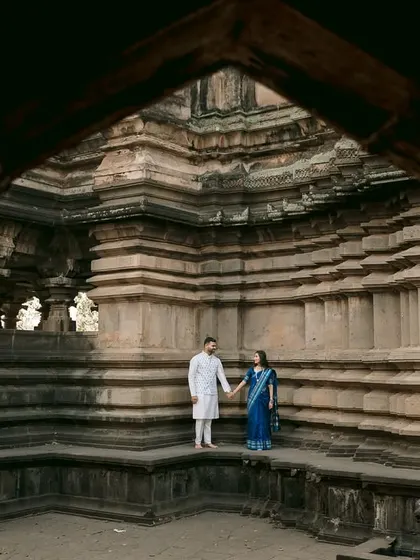 Set against the grand architecture of the Sangam Mahuli temple, this frame tells a story of love as timeless as the stone itself. I love using such epic backdrops to give your pre-wedding portraits a sense of history and grandeur.