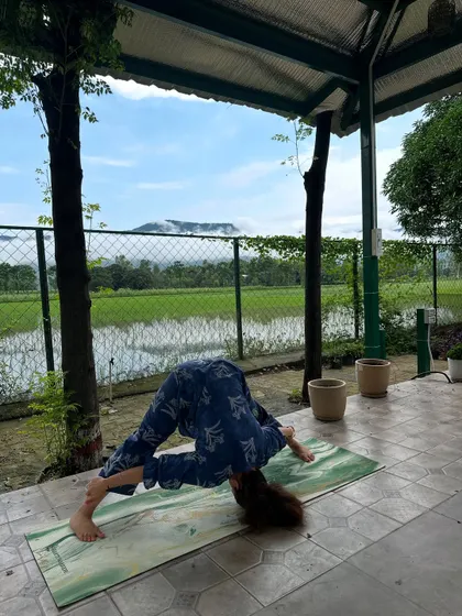 A deep stretch with Prasarita Padottanasana, the wide-legged forward bend. This pose calms the mind and stretches the entire back of the body.