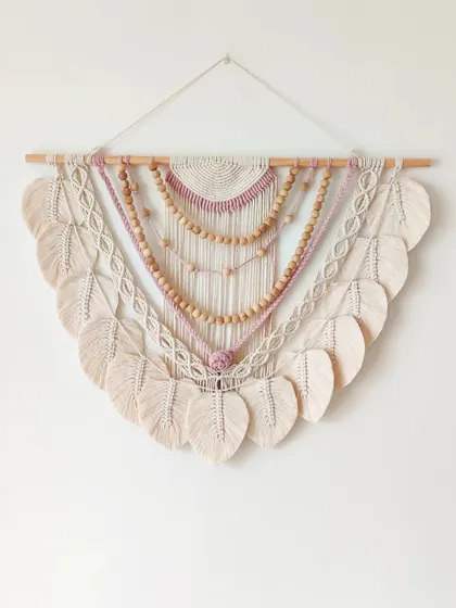 This is a piece I was nervous to start but ended up loving. The combination of colors, beads, and leaves creates a truly stunning boho wall hanging.
