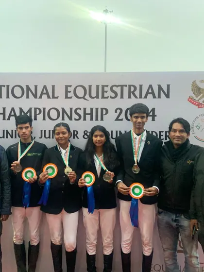 The full team of silver medalists with their coaches. We believe in celebrating together and supporting each other as one team.