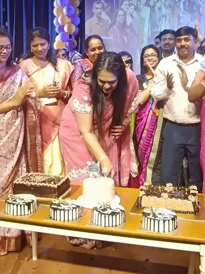A moment of joy and celebration as our principal cuts the Teacher's Day cake, surrounded by happy staff members.