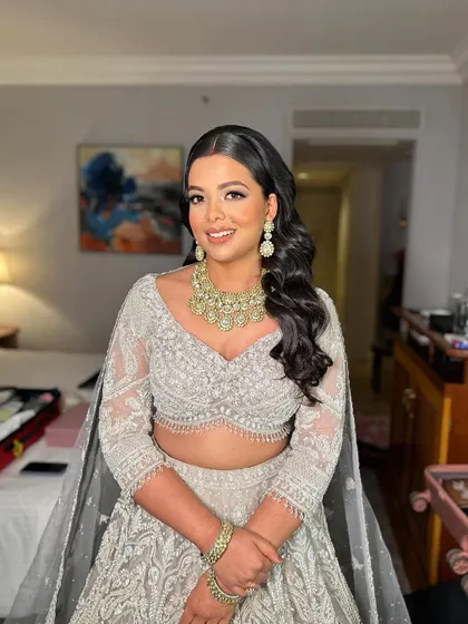 A full portrait of Shreya, looking elegant and poised. The makeup is sophisticated and timeless.