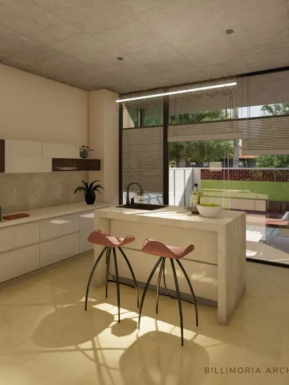 A view of the kitchen island in the Hollywood Town residence, positioned to look out onto the garden through floor-to-ceiling glass. This makes cooking and socializing a light-filled experience.
