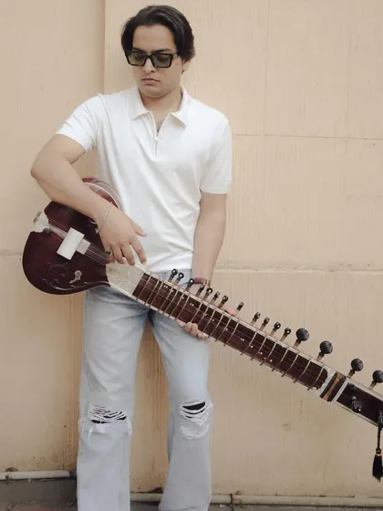 A stylish portrait in a white polo and jeans. This shows the modern, casual side of my personality.