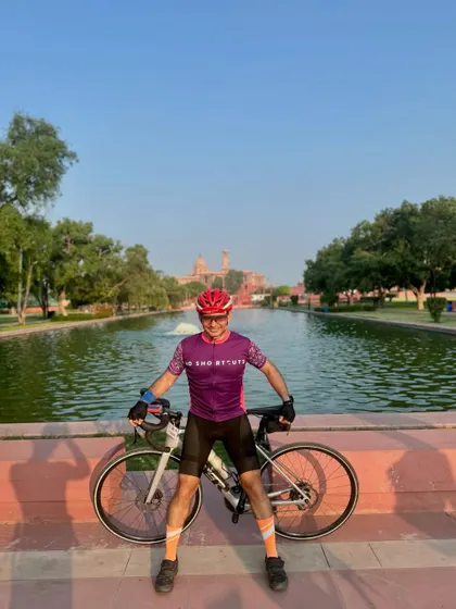 Enjoying the view with his bike at a scenic spot.