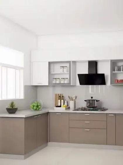 This compact L-shaped kitchen demonstrates efficient space planning with a simple two-tone color scheme. Glass-fronted cabinets break up the solid upper units, adding visual interest and a place to display items.