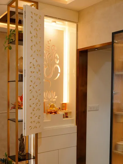 Another view of the modern puja unit, showing how it integrates seamlessly with an open shelving unit, providing space for both sacred idols and decorative items.