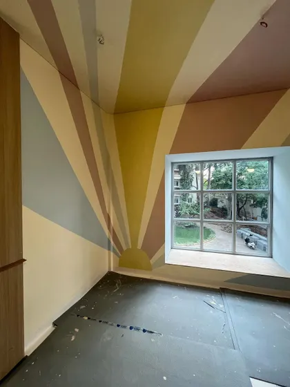 Another view of the sunshine room, showing how the rays wrap around the corner and onto the ceiling.