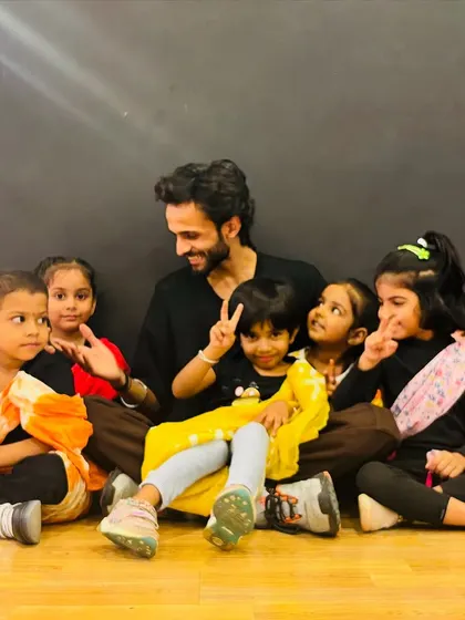 Peace and smiles all around. A happy snap from our kids' class, showing the fun and relaxed vibe we cultivate in the studio.