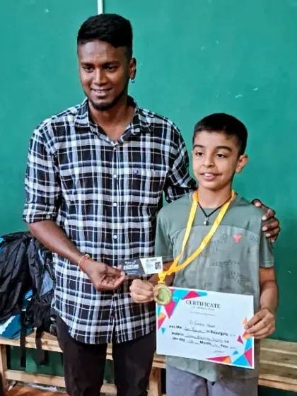 A proud moment as Charvik receives his certificate and medal for reaching the semifinals in a major state open tournament.