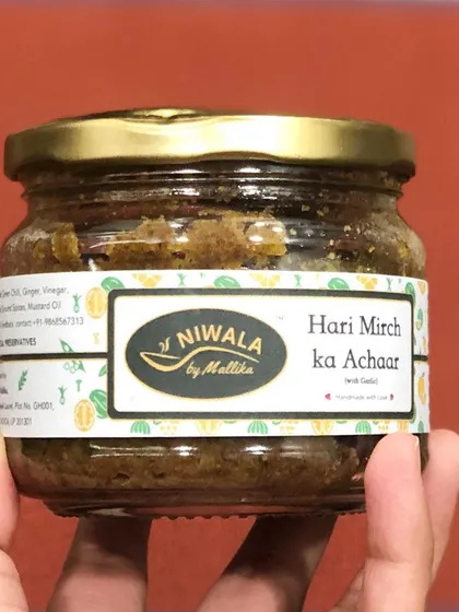 My Hari Mirchi ka Achaar, a fiery pickle made from the freshest green chilies. The spice level varies with each small batch, ensuring a fresh and punchy flavour every time.