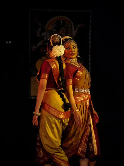 The back-to-back pose in our Ardhanareeshwara performance, highlighting the distinct yet connected nature of the masculine and feminine principles.