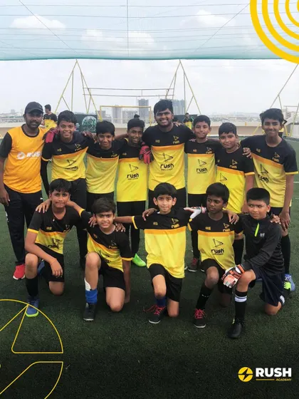The U11 team poses with their coach. These pre-season friendlies are vital for building team chemistry and testing strategies.