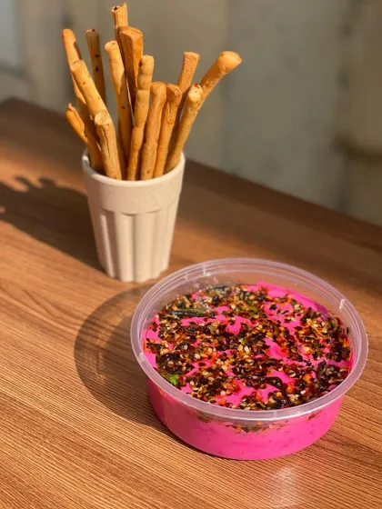 A close-up of the Sizzling Beetroot Yogurt Dip, a beautiful and healthy addition to any party menu.