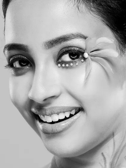 A black and white version of the floral-themed beauty shot, creating a timeless and artistic feel while still highlighting the unique makeup application.
