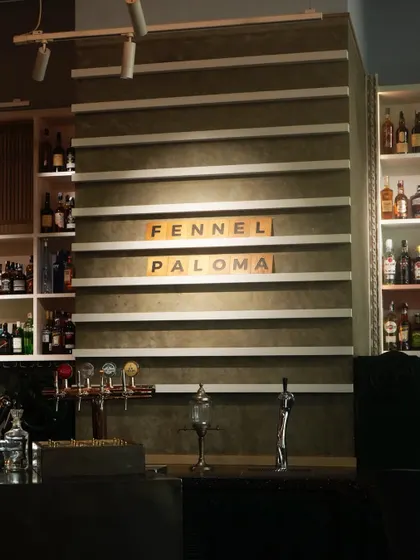 The sign for our Fennel Paloma, highlighting our daily specials and the creative spirit of our bar program.