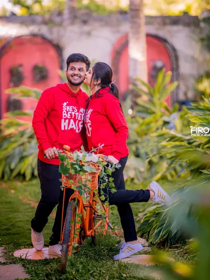 A fun and cute moment with a bicycle and matching hoodies. This shot is perfect for a relaxed, playful pre-wedding shoot that shows off your personality.