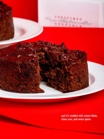 A slice of my rich and moist Christmas Fruit Cake. It's studded with rum-soaked raisins, winter fruits, and sweet spices, making it a true holiday classic.