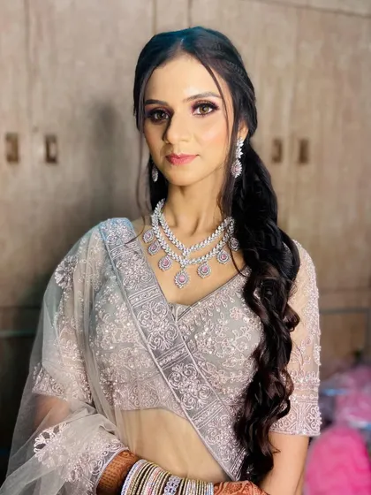 This client looks serene and beautiful. The soft lighting highlights the smooth finish of the airbrush makeup and the delicate shimmer on her eyes.