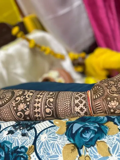 A finished full-arm design laid out, showing the beautiful contrast and flow of different patterns.