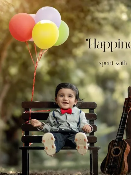 Happiness is a day spent with you. This joyful outdoor first birthday portrait with colorful balloons is full of life and energy.