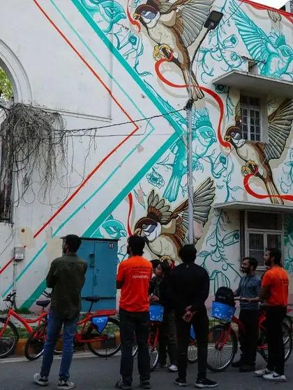 This mural featuring sparrows is a commentary on the loss of biodiversity in urban spaces. Our tours often spark interesting conversations about art and the environment.