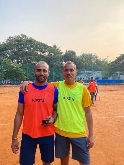 Two players from our adult batch after a good session. We foster a great sense of camaraderie among our members.