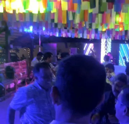 A corporate event for Colt with colorful decorations and a packed dance floor.