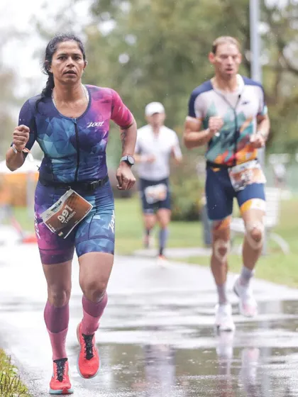 Pushing through the rain during the run. You can't control the weather on race day, but you can control your effort and attitude. My coaching prepares you to handle adversity and perform your best no matter the conditions.