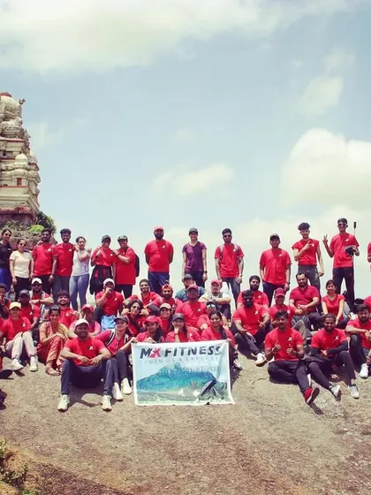 A proud moment for the whole team at the Shivagange summit. This picture captures the scale of our group treks and the shared sense of achievement.