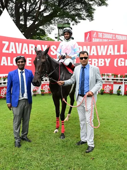 Cascais, winner of The Squanderer Cup, is pictured with jockey Akshay Kumar and the winning connections.