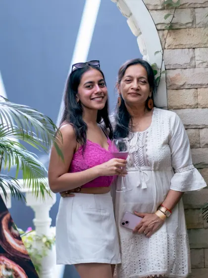 Guests enjoying the outdoor ambiance. The blend of indoor and outdoor spaces allows for a dynamic event flow, giving guests different environments to experience.