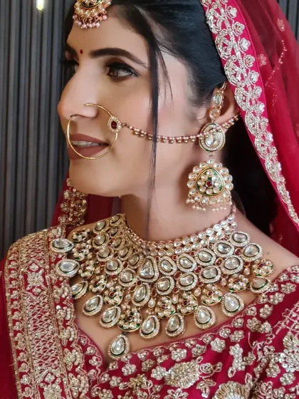 A side profile of this pretty bride, showcasing her stunning kundan jewelry and the flawless finish of her makeup.