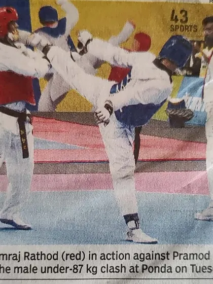 A newspaper clipping from the 37th National Games, capturing a moment of intense action during a Taekwondo match. It is rewarding to see the sport receive this level of coverage.