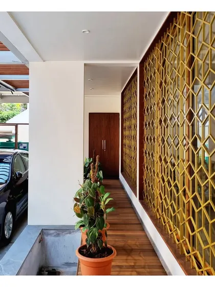 A custom-designed security grill with a repeating geometric pattern that is both functional and decorative.
