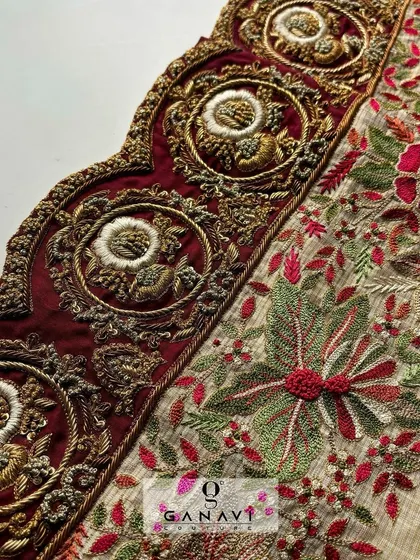 An up-close look at the grandeur of my embroidery work. This image shows the intricate details of a floral and paisley design, featuring rich maroon velvet appliqué and multi-dimensional threadwork.