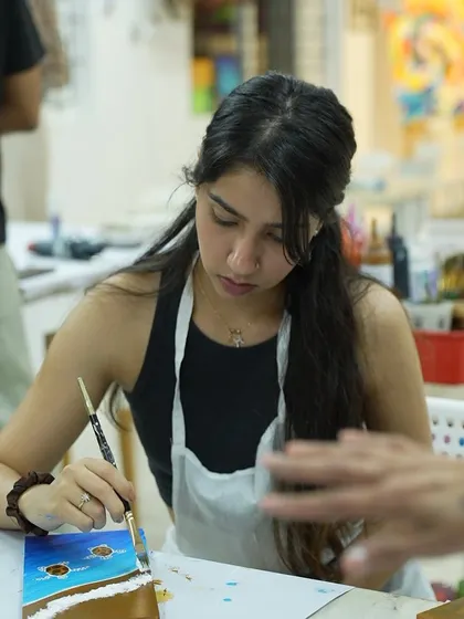 A student enjoys a weekend workshop at our studio. These sessions are a great way to try something new and de-stress.