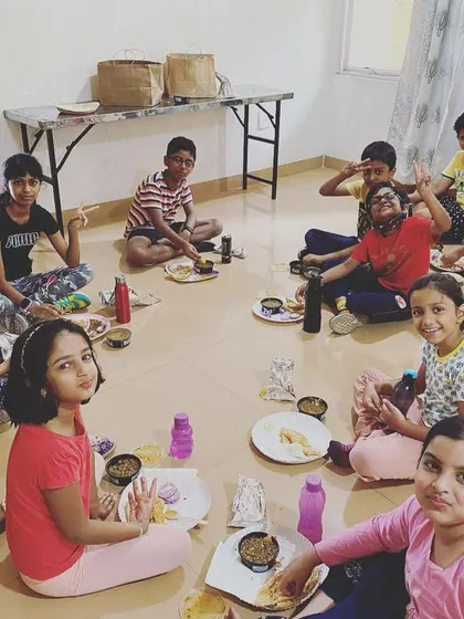 The best reward after a week of hard work at our summer camp. Students enjoy a well-deserved meal of chole bhature together.
