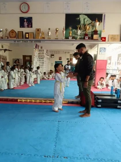 A handshake for a new yellow belt.
