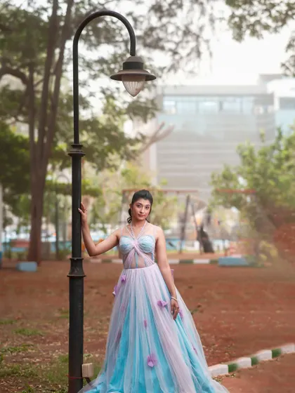 A full-length shot of the model in the park.