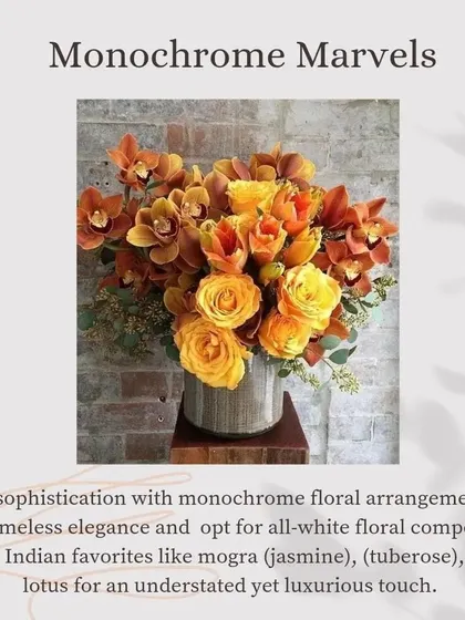 More "Monochrome Marvels" inspiration, this time featuring a luxurious arrangement of orange and yellow orchids and roses for a timeless and elegant look.