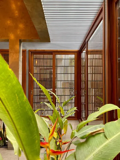 The lush greenery within the courtyard of 'The Mantle', creating a private oasis that brings nature into the core of the home.