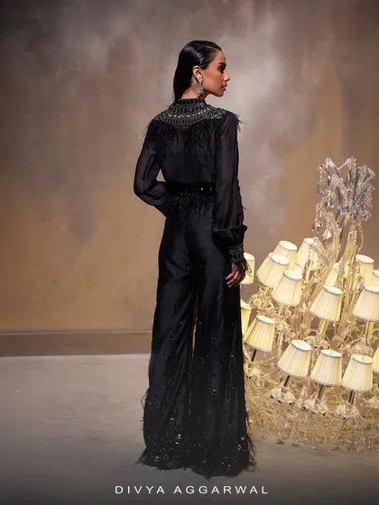 The back view of the Amore Pant Set, showing the clean lines of the sheer top and the continuation of the feather details on the pants.