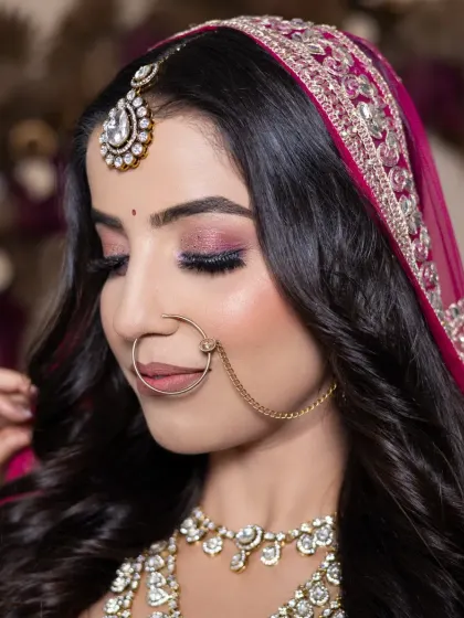 Another beautiful bridal portfolio look created by one of my students. This features a dramatic pink smokey eye with a sharp wing, perfect for a bride who loves a bit of color.