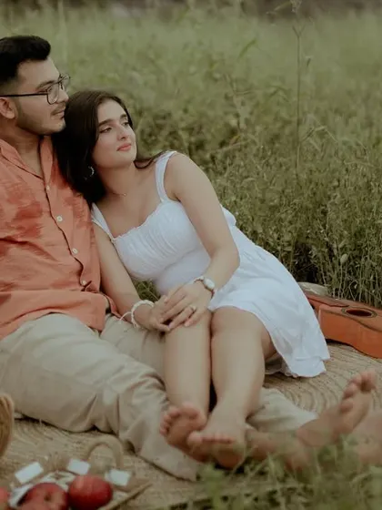 A quiet, contemplative moment of the couple enjoying the serenity of their natural surroundings.