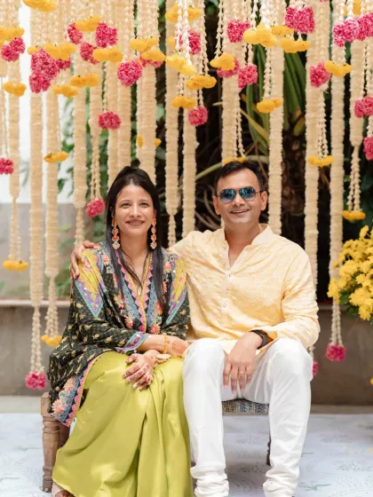 A fusion of cultures. For this North Indian couple who fell in love in Pondicherry, we designed a Haldi and Mehendi evening that blended traditional South Indian elements like banana leaves and brass lamps with vibrant floral decor.