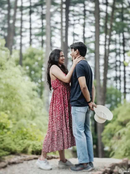 A romantic portrait in a pine forest. The tall trees create a beautiful, enclosing frame, making this moment feel private and intimate, like the couple is in their own world.
