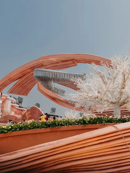 Another angle of the modern architectural decor, featuring white cherry blossom trees. This design proves that wedding decor can be both artistic and deeply romantic.