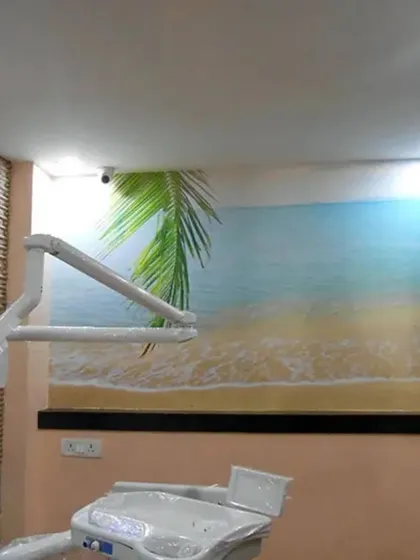A tranquil beach scene mural helps create a relaxing atmosphere in this dental clinic. A calming view like this can help ease patient nerves and make the space feel less clinical and more welcoming.