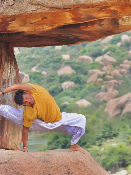 Using the support of a rock in Hampi to deepen a challenging side-body stretch. My practice is about constantly preparing my body and mind to break limitations and discover new abilities.